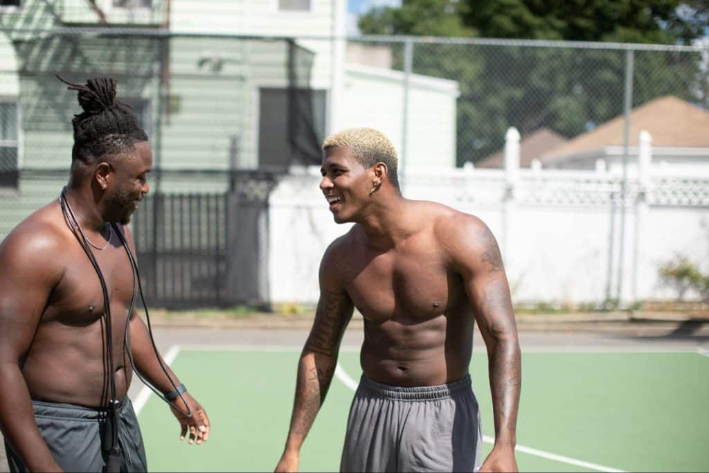 Two men stopping working-out