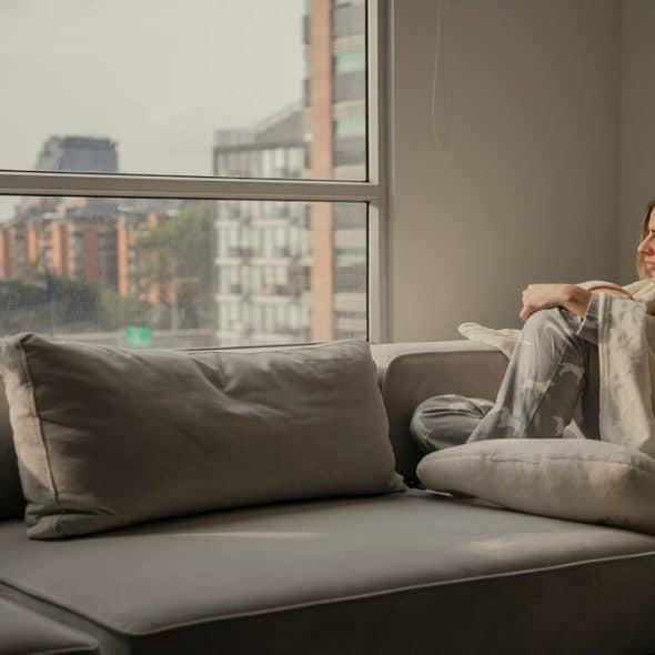 A woman looking out the window.