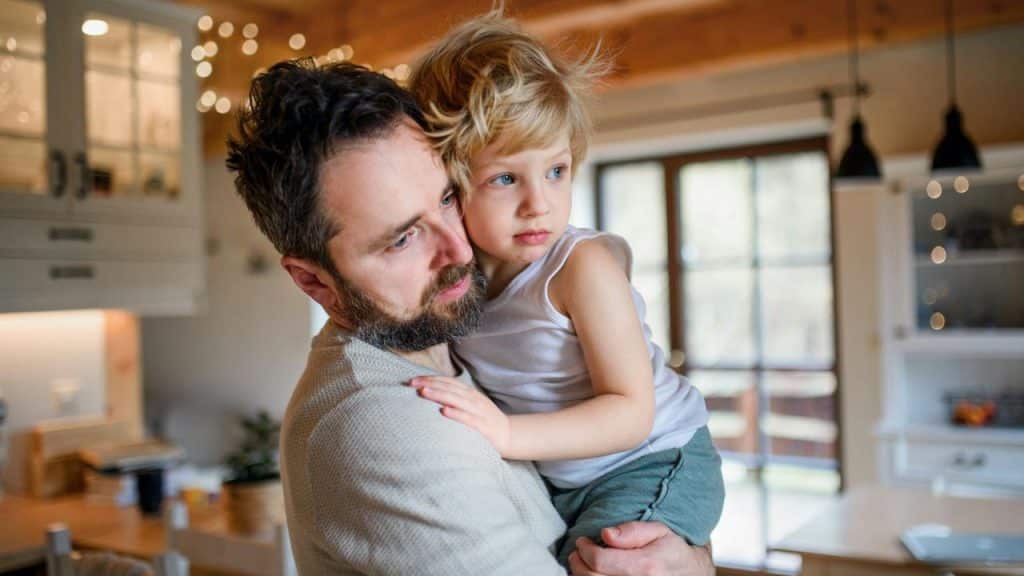 A man holding a young child.