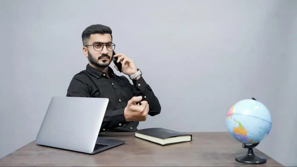 A man listening to a phone call before responding.