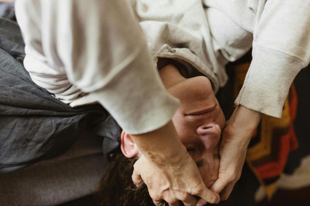 A man holding his head