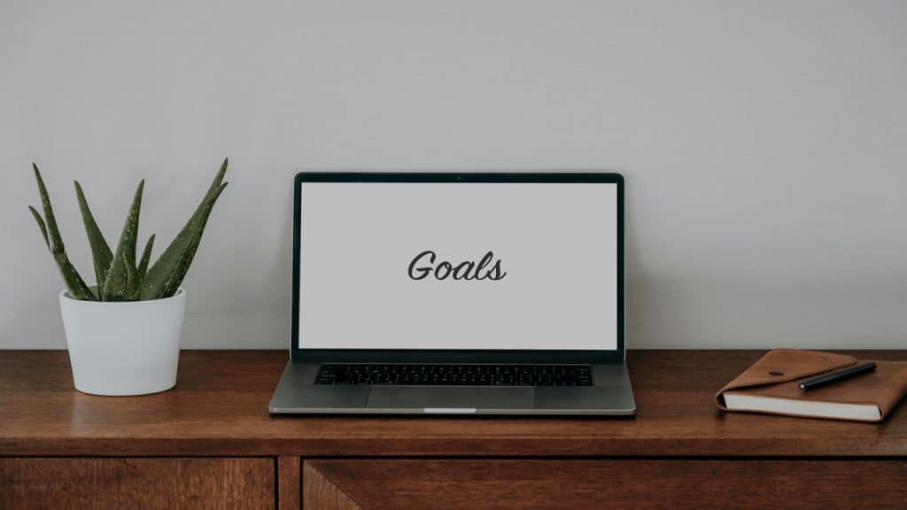 A laptop featuring the word “goals” 