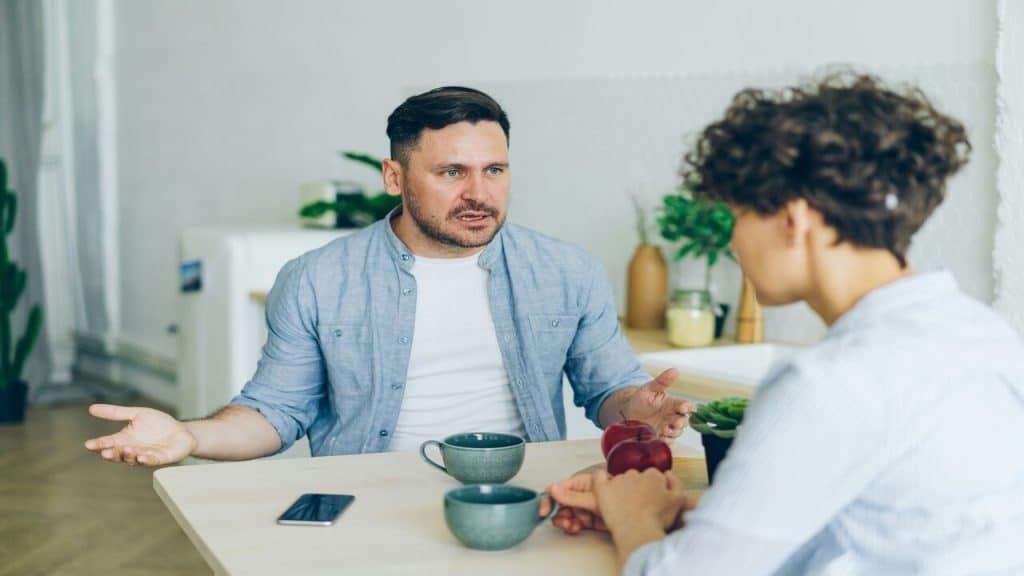 A couple arguing in the kitchen
