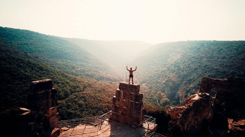 A man looking at the mountains