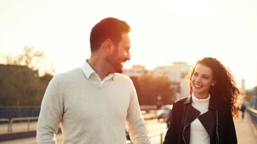 A man receiving a polite decline and responding with a smile