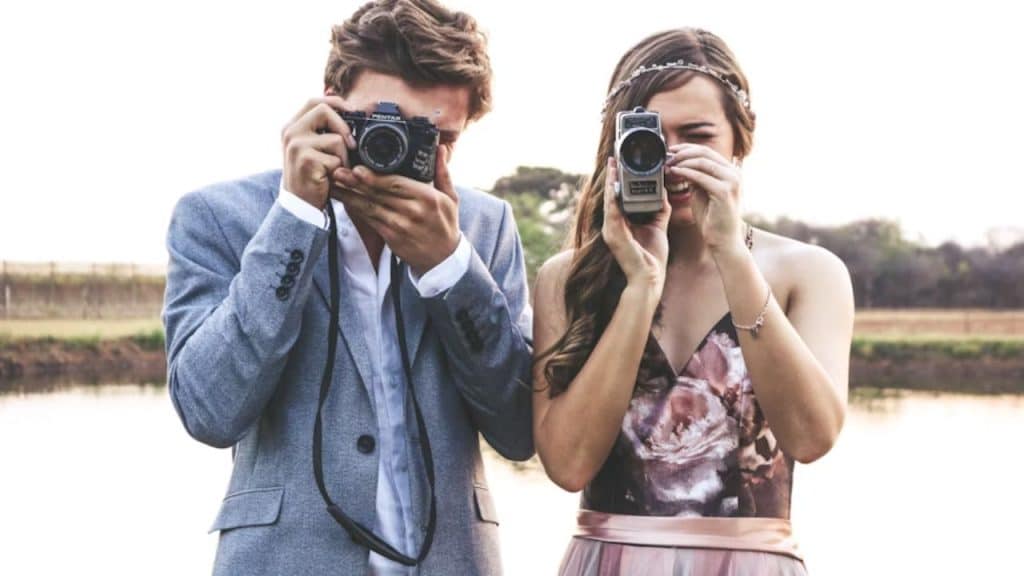 Couple learning photography together to bring freshness to their relationship.