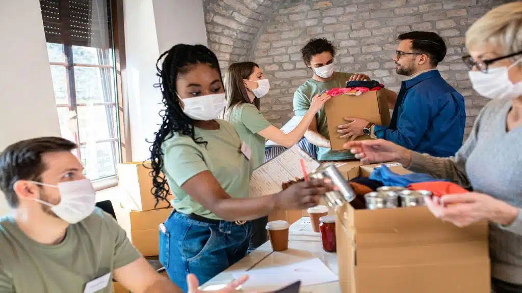 Volunteers handing out aid