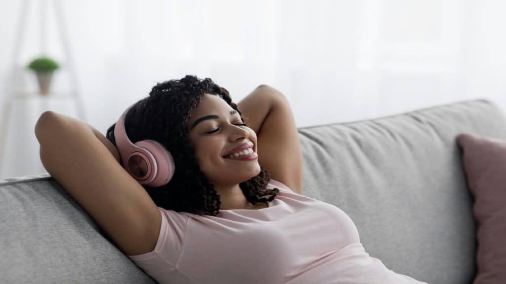 A woman listening to music at home