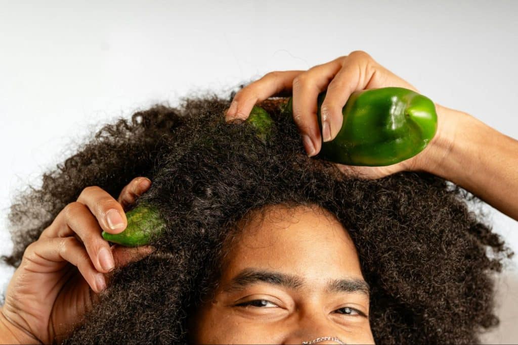A man holding a vegetable