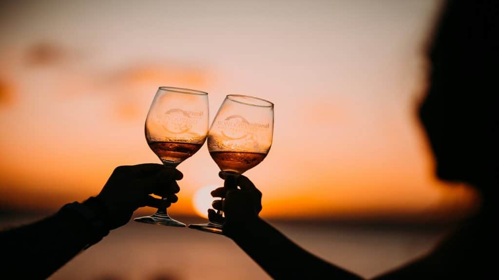A couple toasting two wine glasses