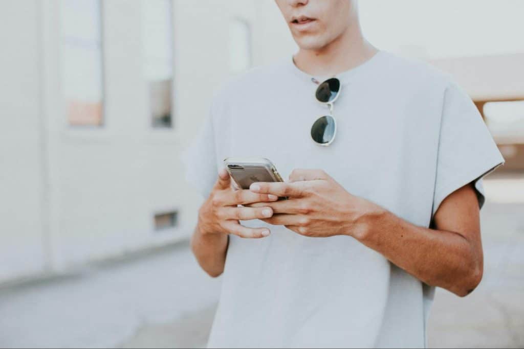 A man texting a woman.