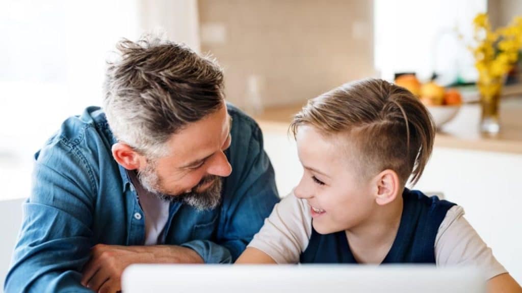 Man encouraging his teen with meaningful, character based praise