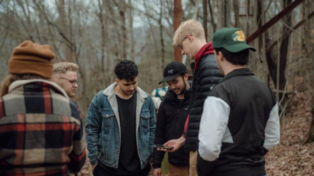 Group of men attending a guided therapy session outdoors