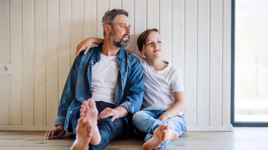 Man quietly supporting his teen with steady presence