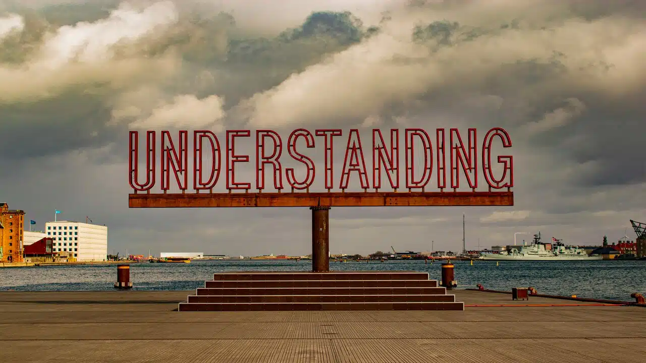 An outdoor sign saying “understanding”.