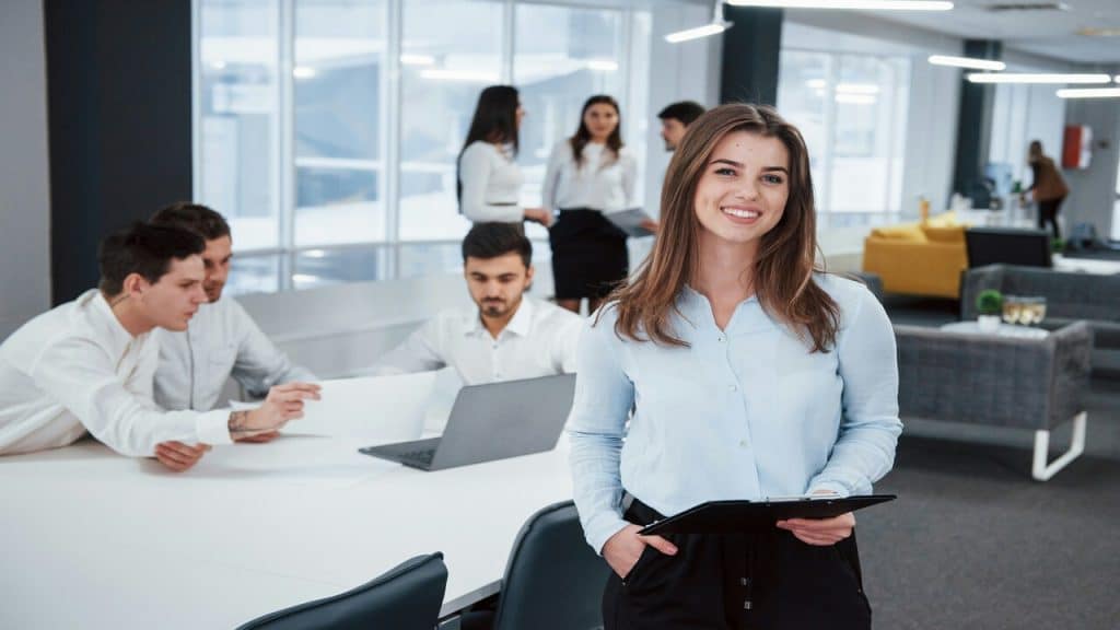 A woman smiling at the office.