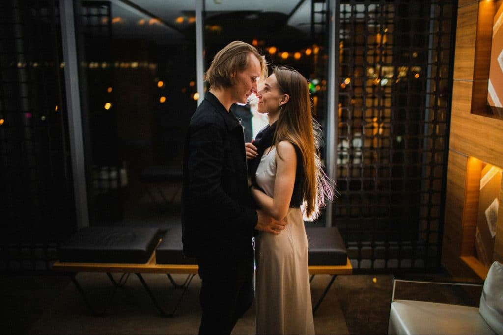 A man and woman facing each other 