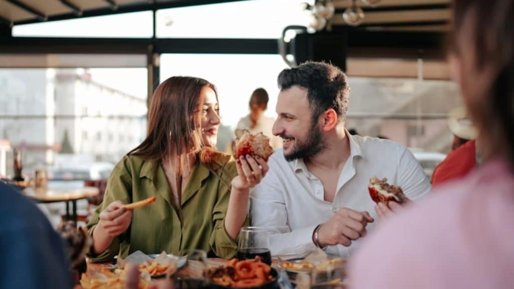 Couple joining friends for a meal