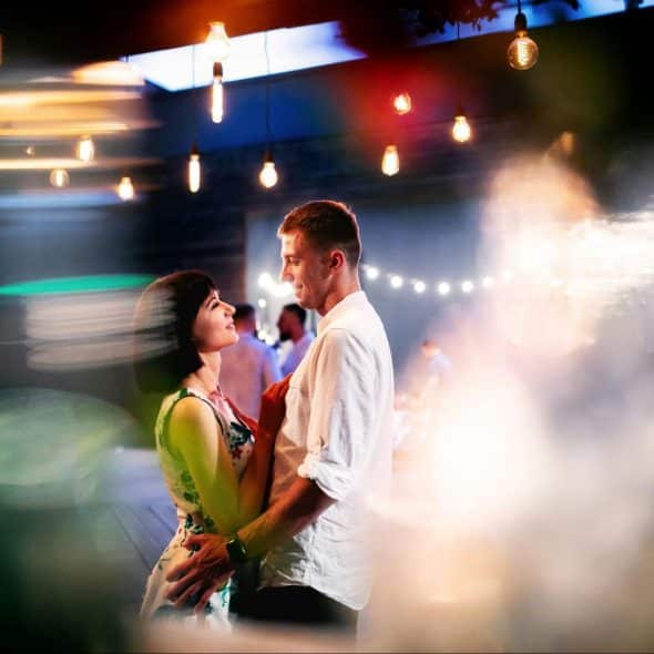 A picture of a man and woman surrounded by lights