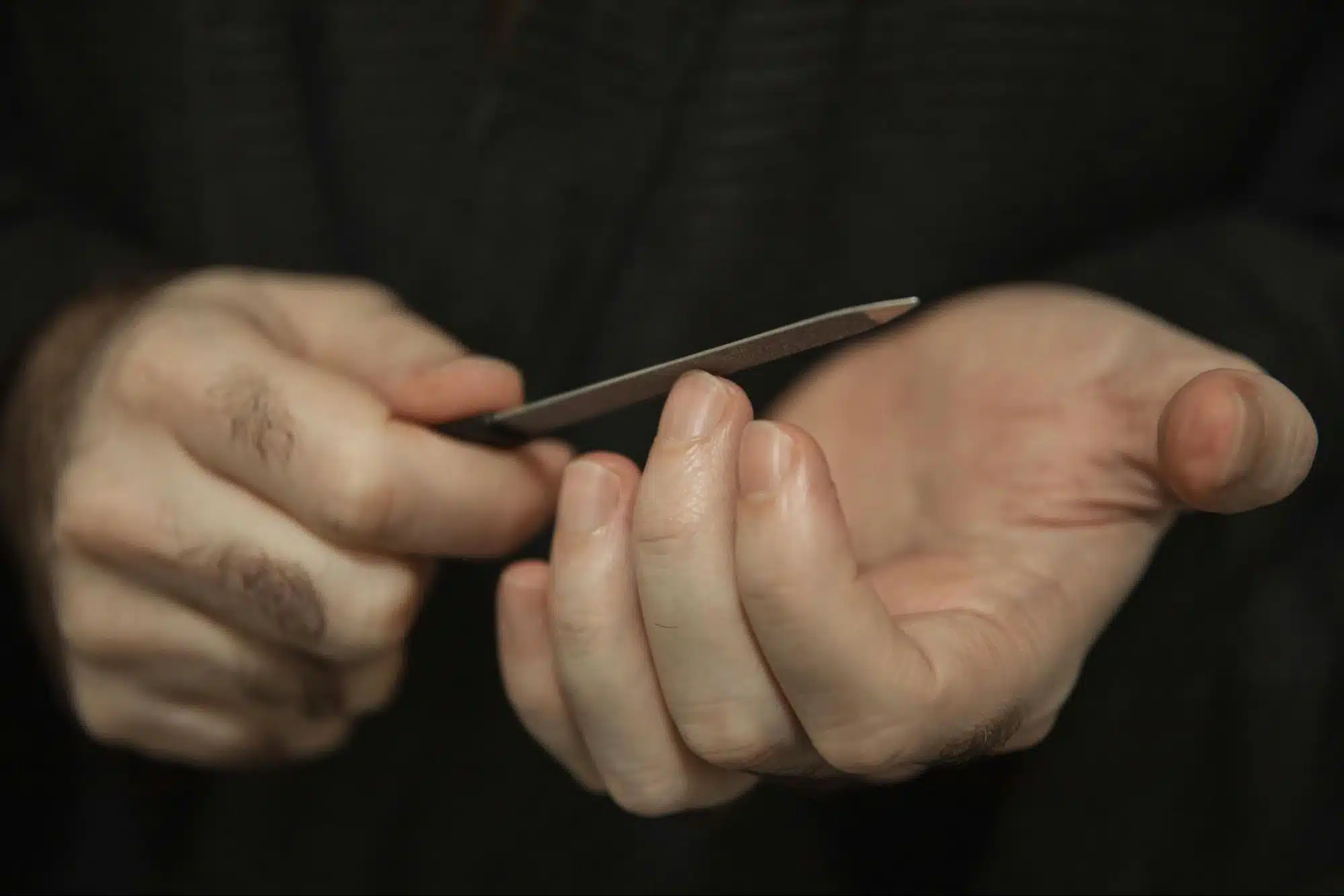A man scratching his nails.