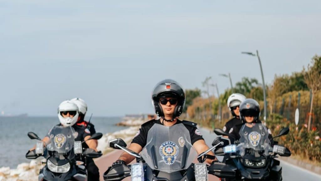 Group of men traveling together on motorcycles