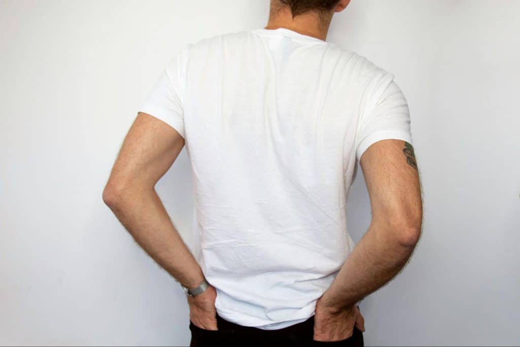 A man wearing a white shirt.