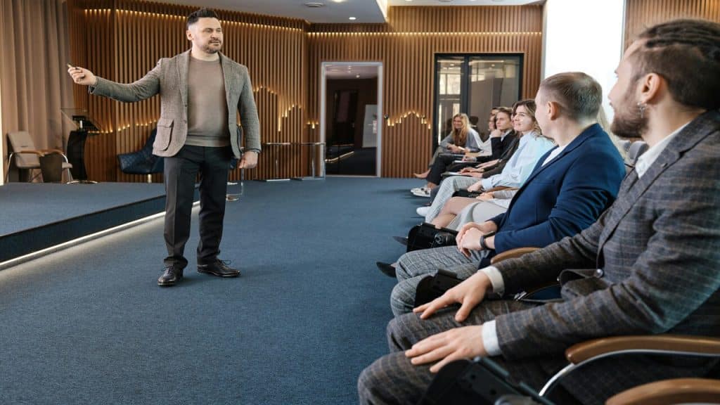 A man presenting in front of a group of people