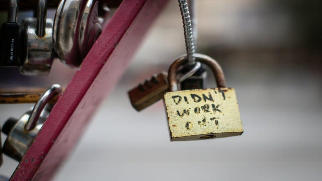 A padlock with the words “didn’t work out” written on it