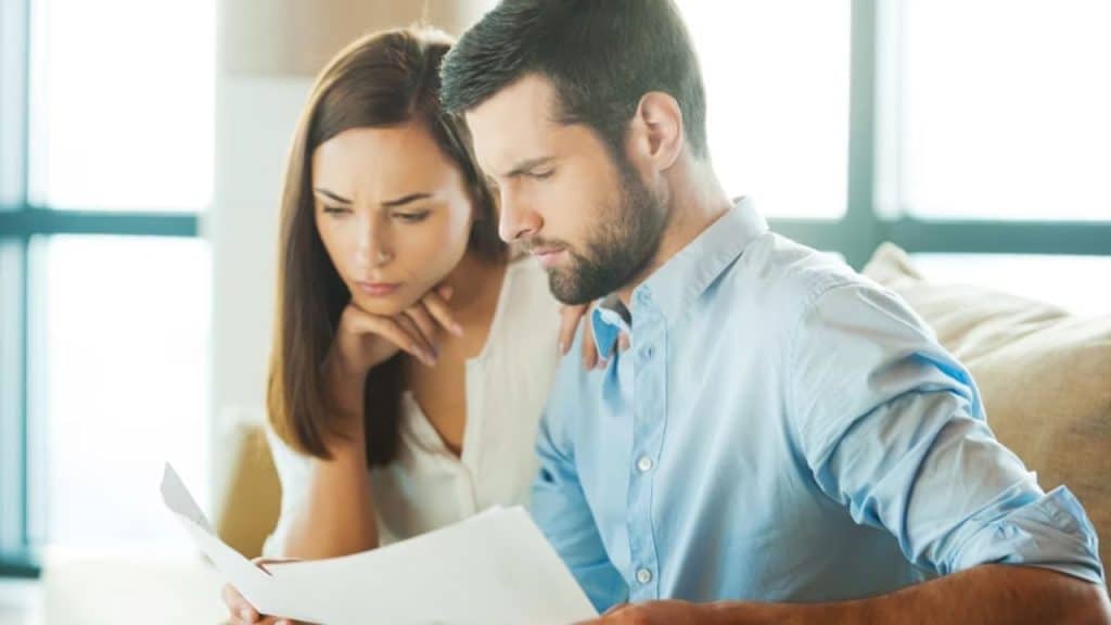 Couple openly discussing financial situation or debt.