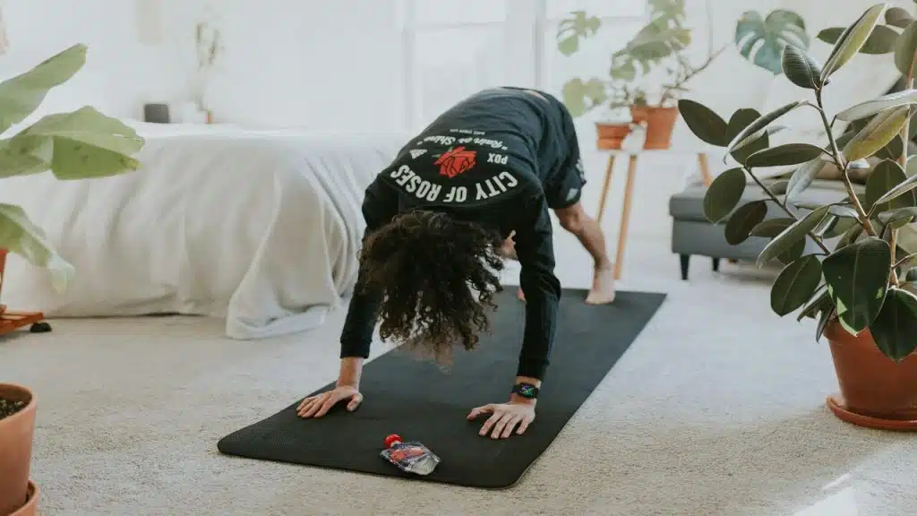 A woman stretching at home