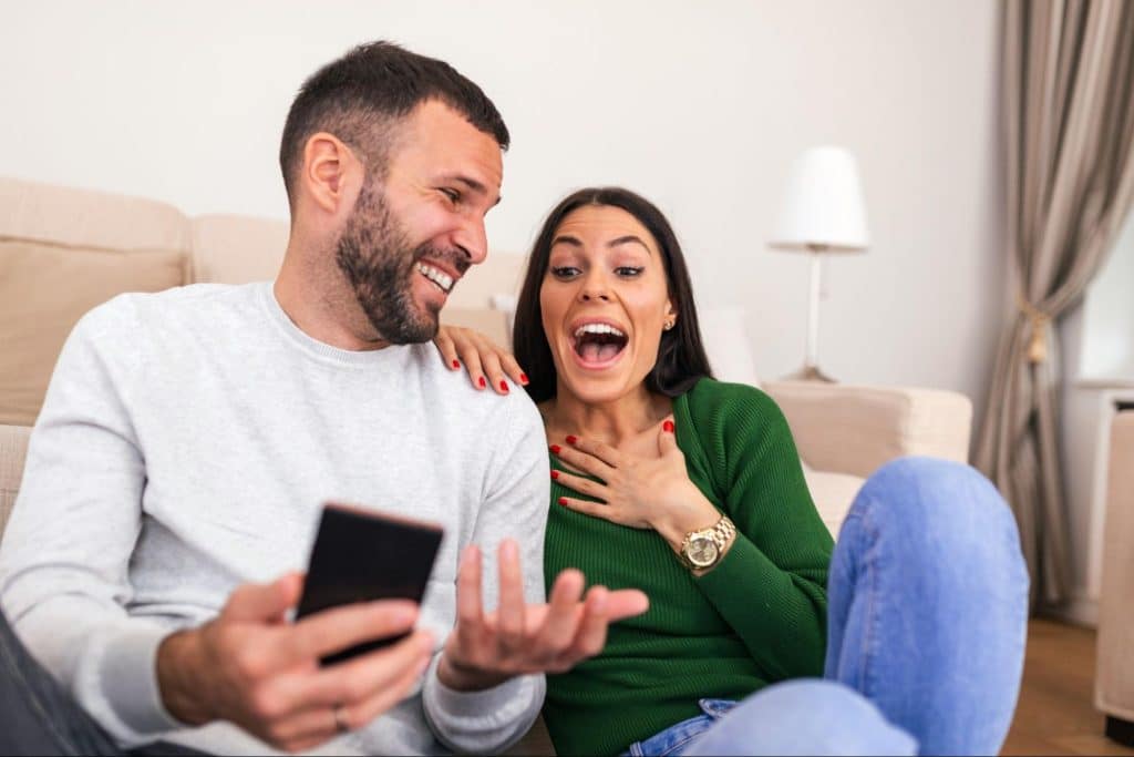 A man making a woman laugh.