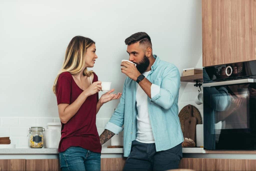A man and woman having a coffee while a woman talking.