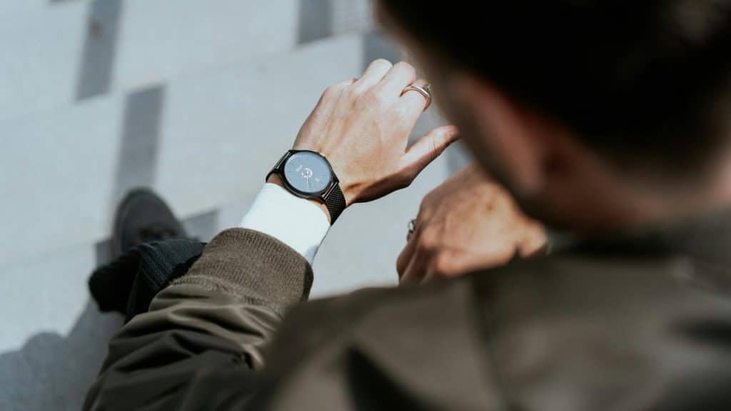 A person checking a wristwatch.