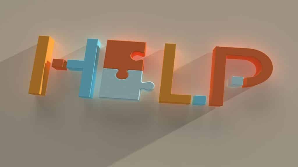 Puzzle pieces spelling out “help”