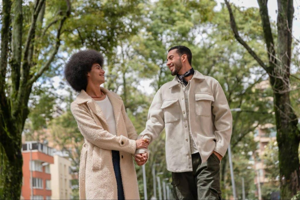 A man and woman walking at the park.