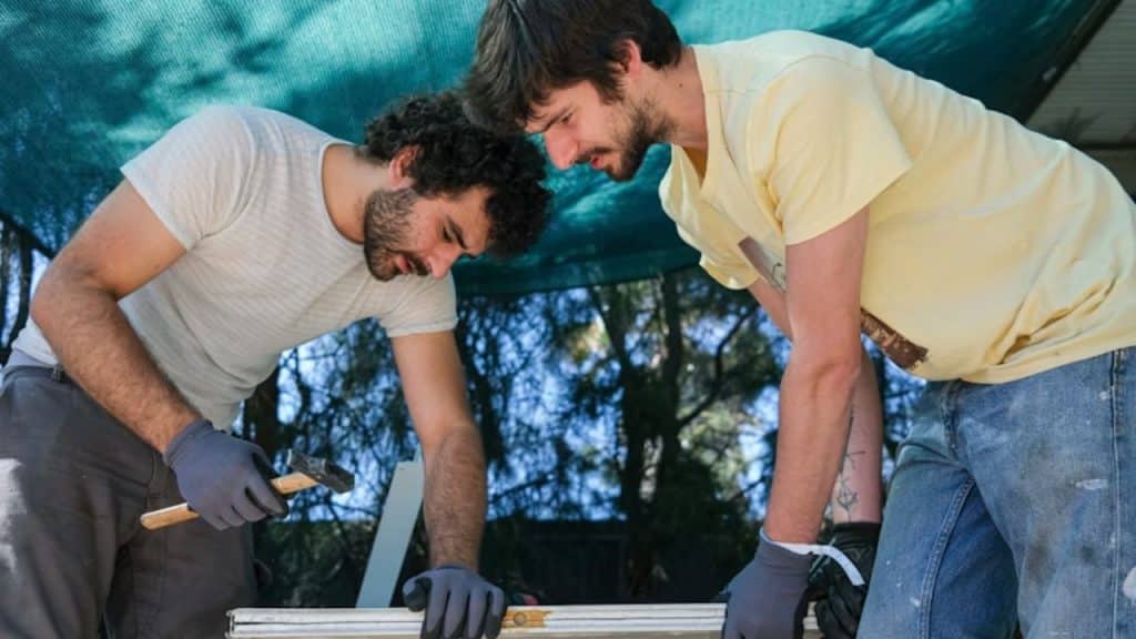 Men working on a DIY or woodworking project together