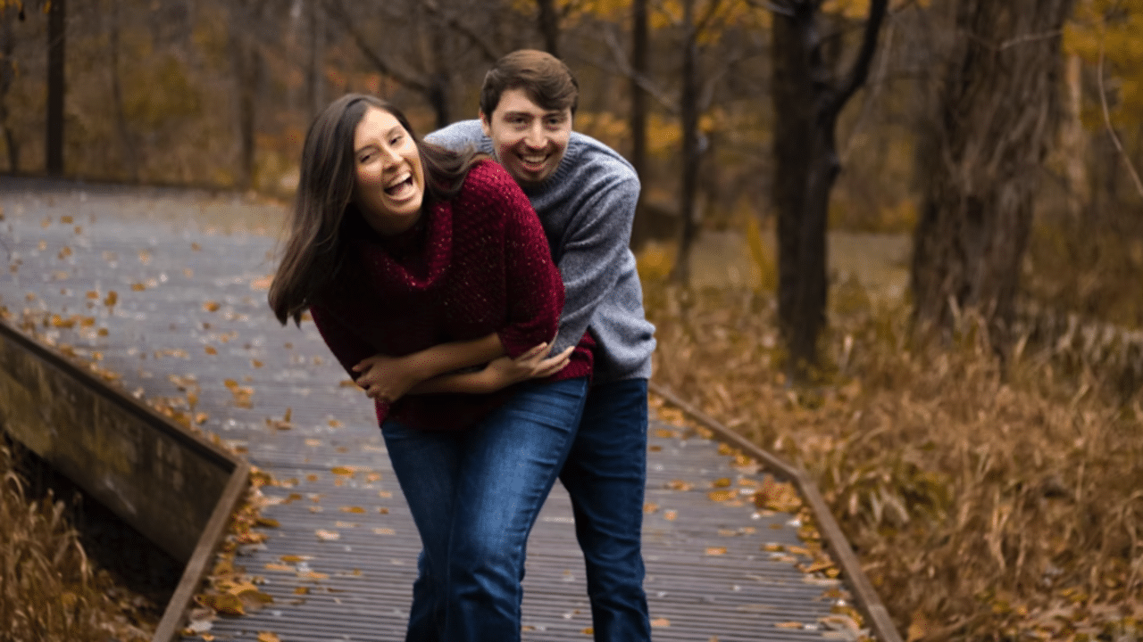 A couple laughing together.