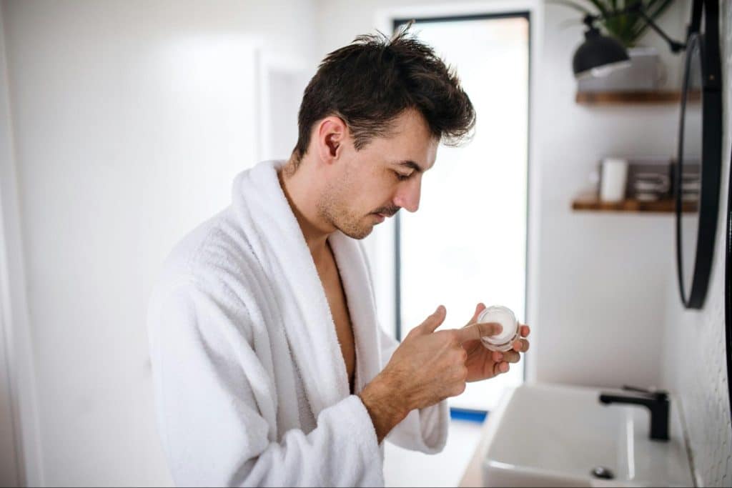 A man taking a cream.
