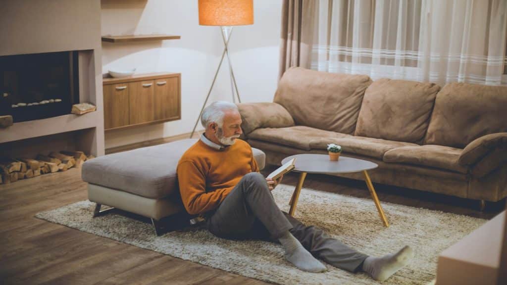 An older man studying at home