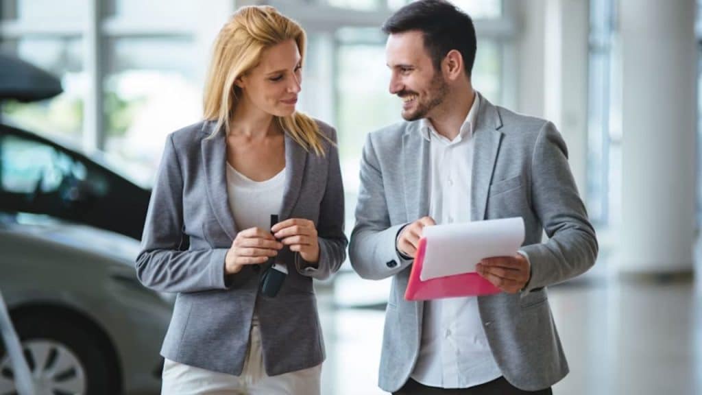A man chatting with a woman, keeping a friendly but respectful distance