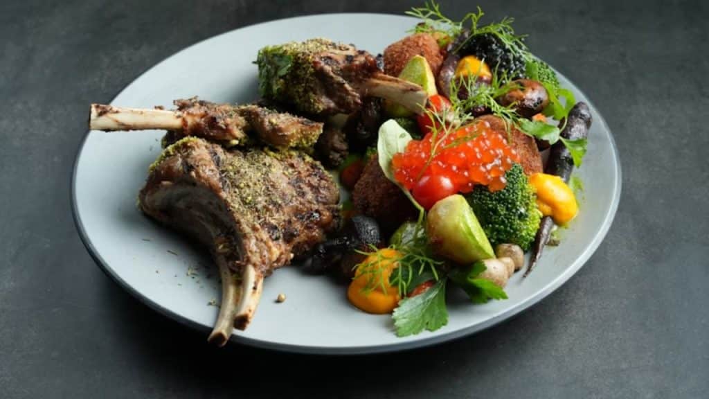 Plate with meat and plant based food.