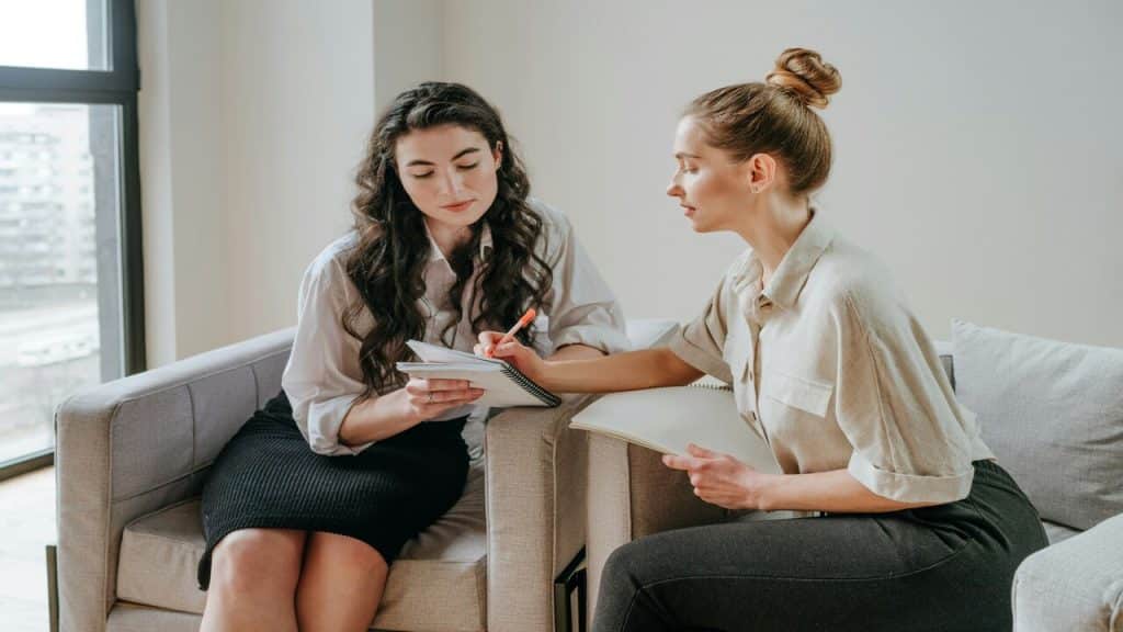 A career coaching helping an employee