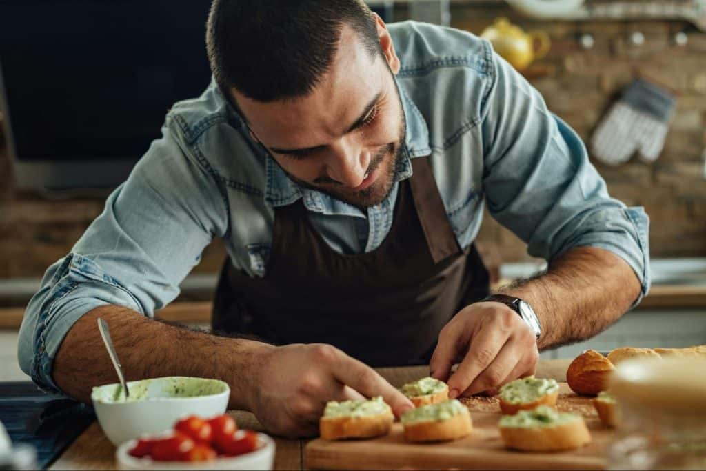 A man preparing a food to eat.