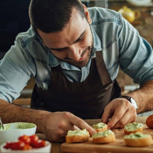 A man preparing a food to eat.