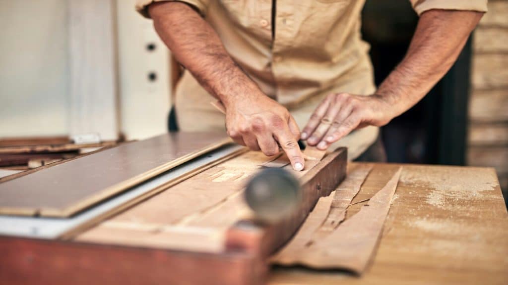 A man assembling furniture