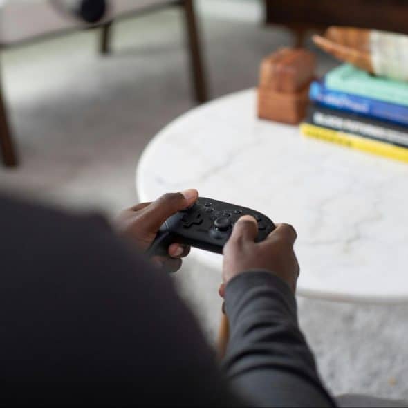 A man holding a game controller