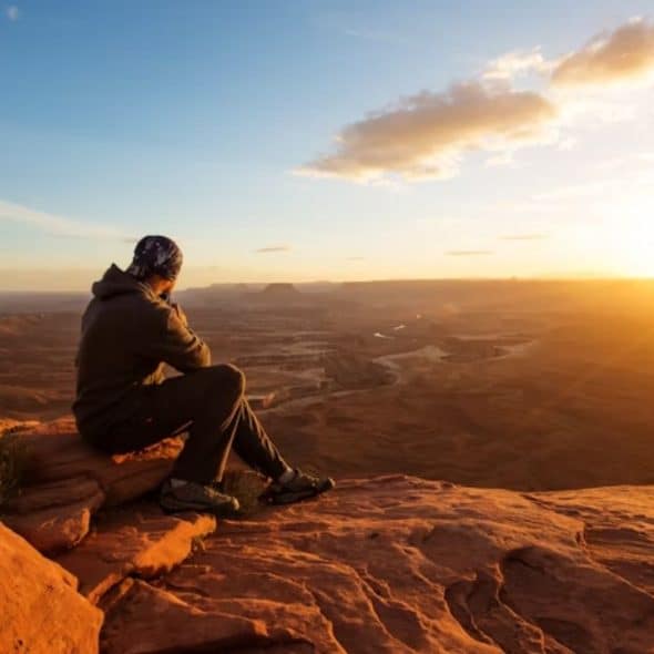 Man reflecting quietly after experiencing heartbreak