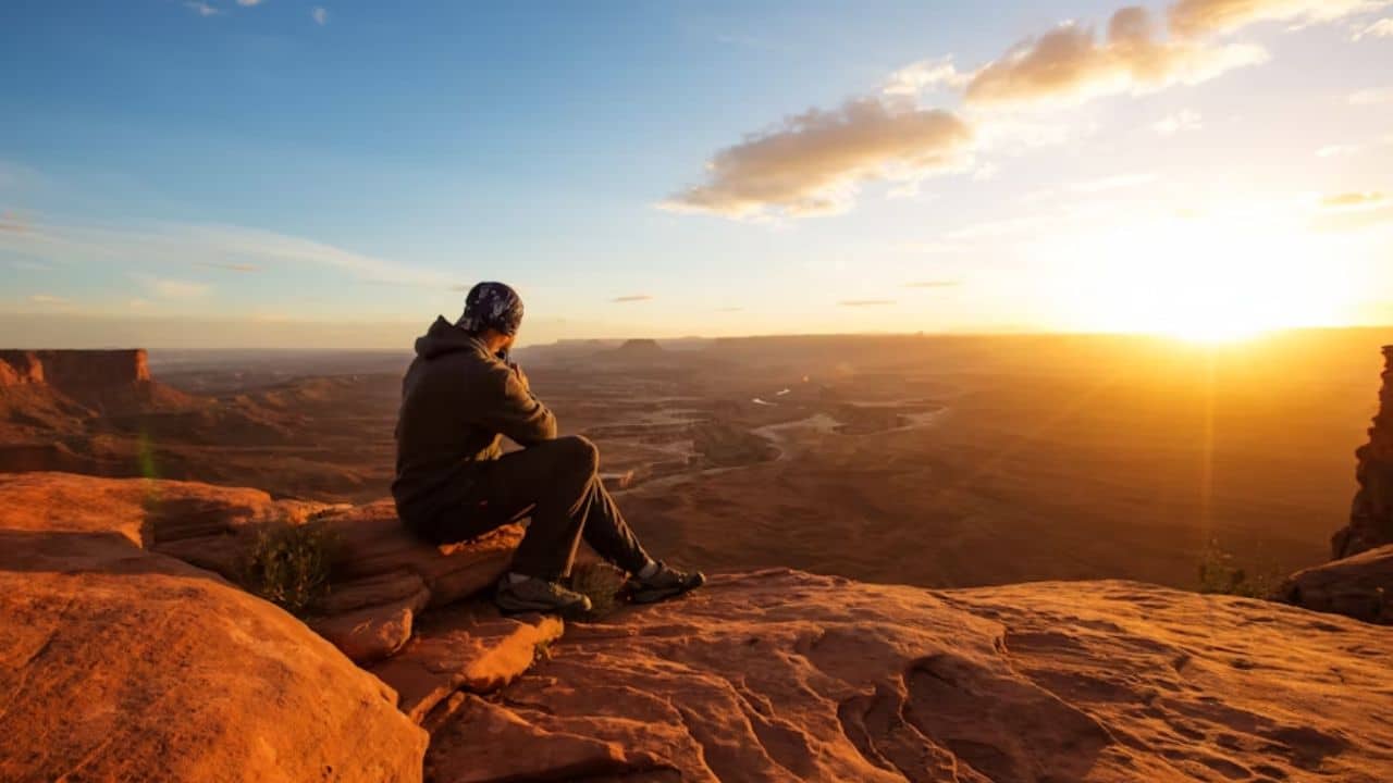 Man reflecting quietly after experiencing heartbreak