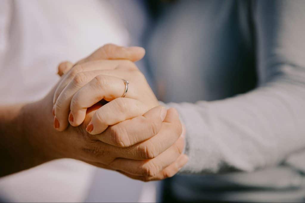 A man and woman holding hands 