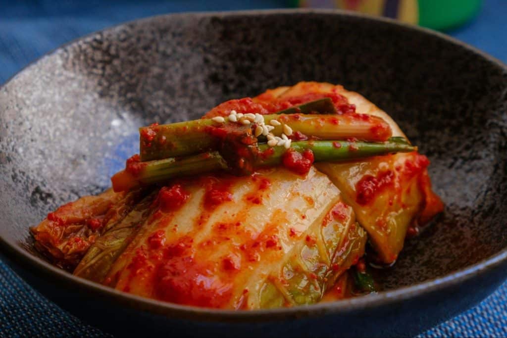 A picture of kimchi served on bowl.